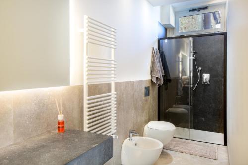 a bathroom with a sink and a toilet and a shower at B&B il Barbero in Siena