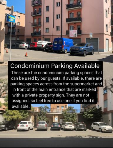 a sign in a parking lot with cars parked at Dodo House La Spezia in La Spezia