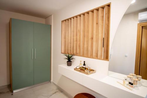 a bathroom with a glass shower and a sink at Ligiades 945 in Ligiades