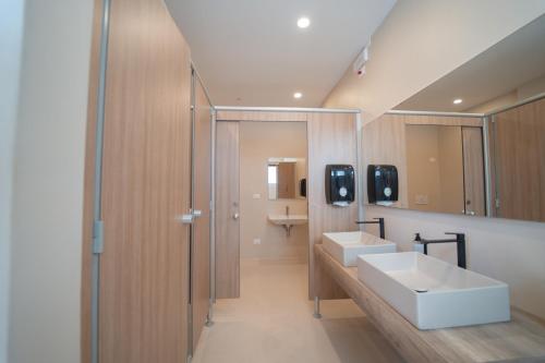 a bathroom with two sinks and a mirror at Park Gallanti in Lido di Pomposa