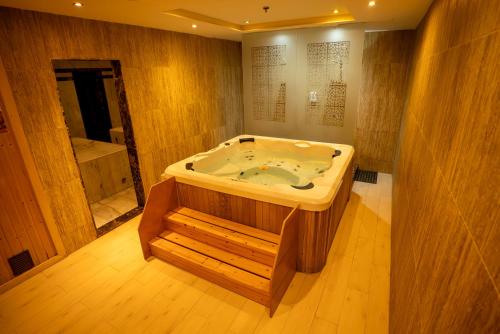 a bathroom with a jacuzzi tub in a room at Shams Alam Beach Resort in Marsa Alam City