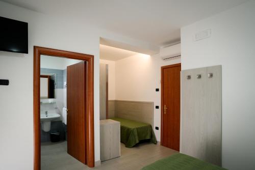 Postel nebo postele na pokoji v ubytování Hotel Clipper