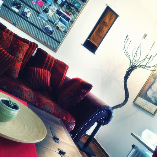 a living room with a chair and a table at Hofwiese in Hohenschwangau