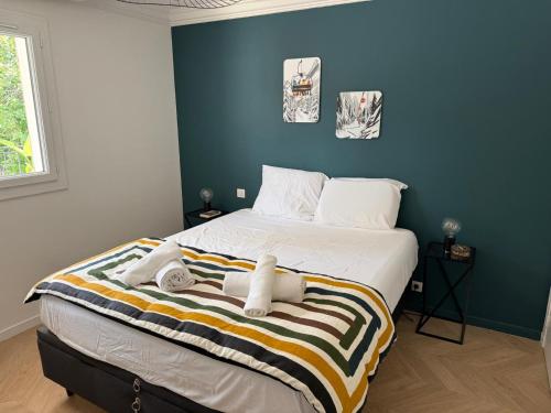 a bedroom with a bed with towels on it at Premium Apartment with Private Jacuzzi in Mougins