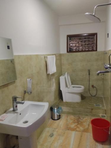 a bathroom with a sink and a toilet at Anamnagar Union House in Kathmandu