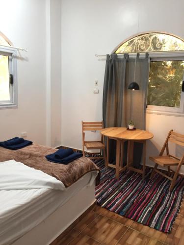Postel nebo postele na pokoji v ubytování The Mango Guest House