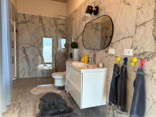 a bathroom with a sink and a mirror at Blue Moon in Zărneşti