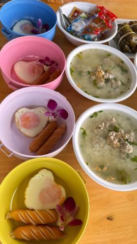 a group of bowls of food on a table at แพบ้านแม่ in Ban Tha Ta On