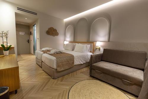 Maxion Hotel tesisinde bir odada yatak veya yataklar