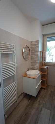 a bathroom with a sink and a mirror at Casa Soria in Pesaro