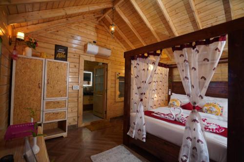 a bedroom with two beds in a wooden cabin at KPHB Wooden Cottages in Hyderabad