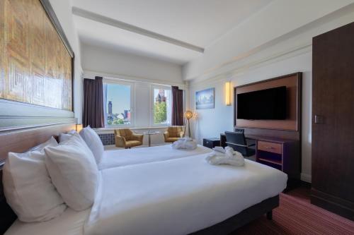 Televisyen dan/atau pusat hiburan di Amrâth Hotel DuCasque