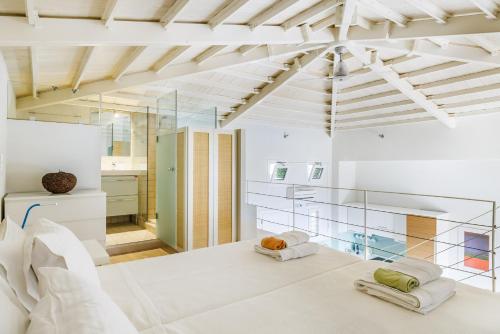 a kitchen with white walls and a ceiling at Elies Houses in Agnontas