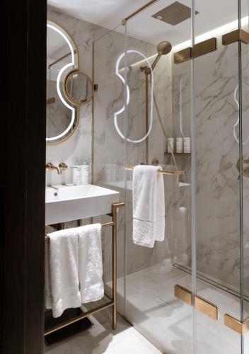 a bathroom with a shower and a sink at The Guardsman Hotel in London