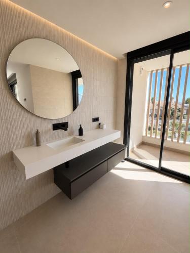 a bathroom with a sink and a mirror at Our long Vacation in Quesada in Ciudad Quesada