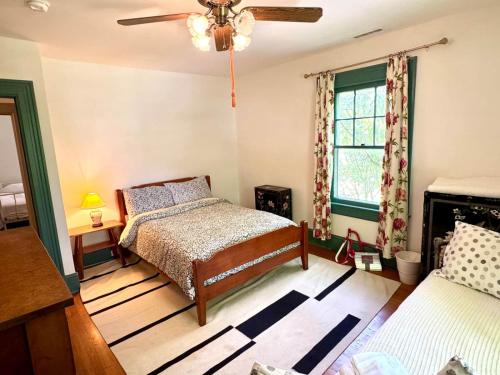 a bedroom with a bed and a ceiling fan at Camden at Monticello in Salisbury