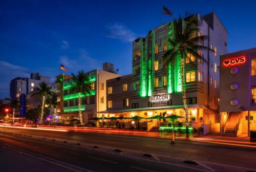 a building with green lights on the side of a street at Beacon South Beach Hotel in Miami Beach