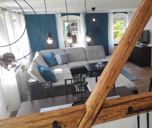 a living room with a couch and a table at Apartment Selina in Lichtenhain