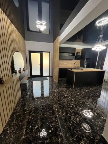a bathroom with a tub and a sink at IUNIk in Azuga