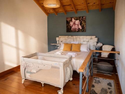 a bedroom with a bed with a wooden table at Casa Ada con Terraza Panorámica al Roque Bentayga by Canarias Prime Homes in Tejeda
