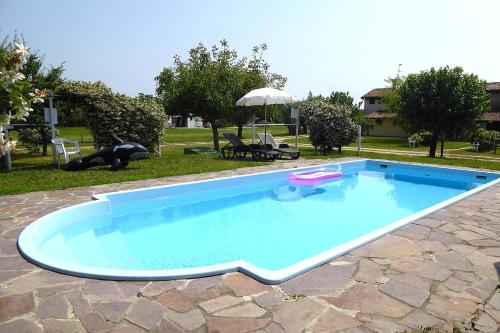 a large swimming pool in a yard at Silea Apartments, Pool, Garden, Treviso in Silea