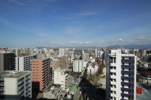 a view of a city with tall buildings at Hotel Monte Hermana Fukuoka in Fukuoka