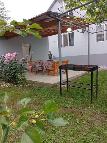 a ping pong table in the yard of a house at Shahdag Beloved Home in Qusar