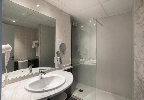 a bathroom with a sink and a shower at Medplaya Hotel Riudor - Adults Recommended in Benidorm