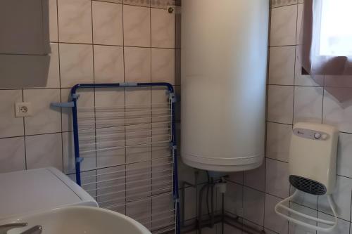 a bathroom with a toilet and a sink at Gîte de montagne in Ventron