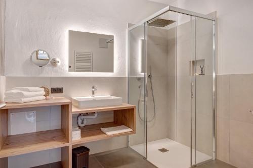 a bathroom with a sink and a shower at Schartenblick in Sarntal