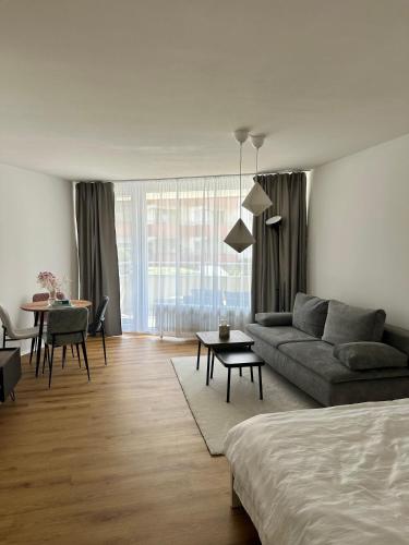 a living room with a couch and a table at See Sun in Uhldingen-Mühlhofen