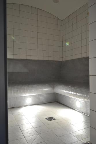 a room with a bed with lights on it at Depandance Vodoléčba in Lázně Libverda