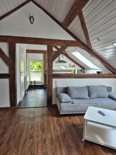 a living room with a couch and a table at Ferienwohnung Moos in Haiger