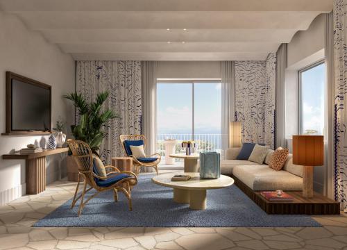a living room with a couch and a table at Jumeirah Capri Palace in Anacapri