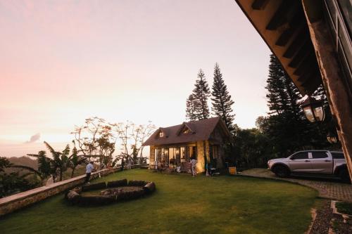 a house with a car parked in front of it at The Old Country Stone House in Cebu City