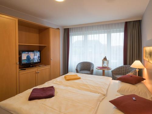 Ένα ή περισσότερα κρεβάτια σε δωμάτιο στο Hotel Spiekeroog