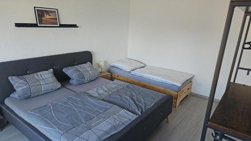 a living room with a bed and a couch at Ferienwohnung An Der Kapelle in Rickenbach