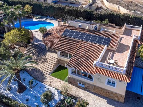 an aerial view of a house with solar panels on the roof at Villas Guzman - Xenia in Calpe