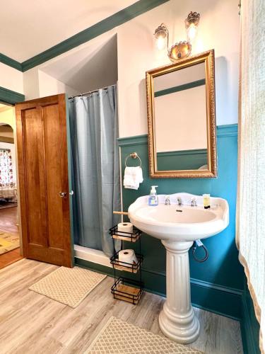a bathroom with a sink and a mirror at Camden at Monticello in Salisbury