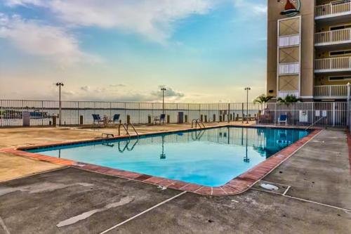 a swimming pool in a parking lot at a hotel at Wight Bay North #439 in Ocean City