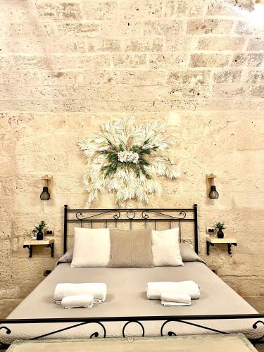 a bedroom with a bed with two pillows on it at L’Antica Dimora in Bari