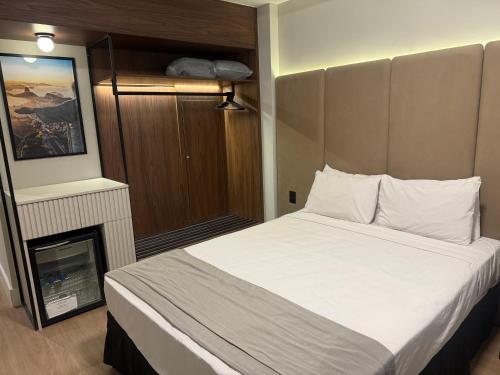 a bedroom with a large bed and a fireplace at Américas Benidorm Hotel in Rio de Janeiro