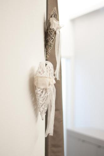 a towel hanging on the door of a refrigerator at 29 by Le Suite in Lugo