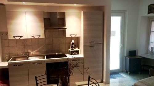 a kitchen with a sink and a stove at Almes' home in Bosisio Parini