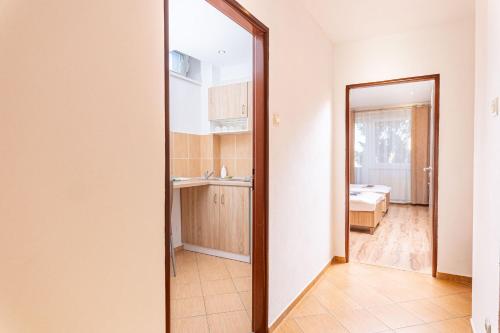 a mirror in a room with a bathroom at Penzión ORION in Prievidza