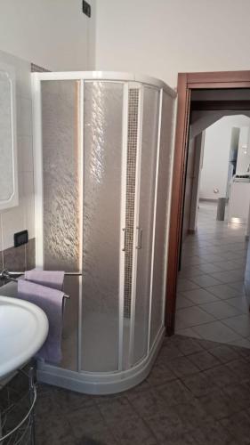 a bathroom with a shower and a sink in a room at 95 by Le Suite in Lugo