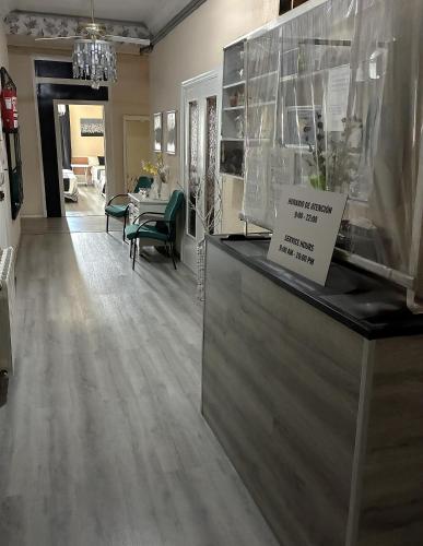 a store with a counter with a sign on it at Hospedaje Botin in Santander