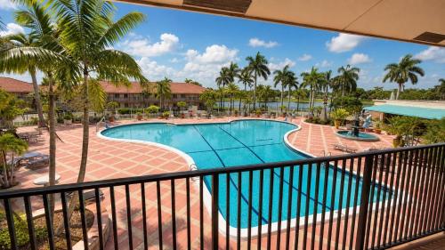 a view of a swimming pool from a balcony at Royal Inn Hotel in Royal Palm Beach