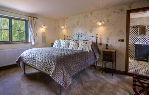 a bedroom with a large bed in a room at Palé Hall Hotel & Spa in Bala