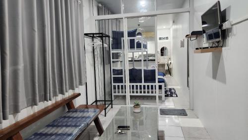 a living room with a couch and a glass table at 338 Studio in Ban Liam